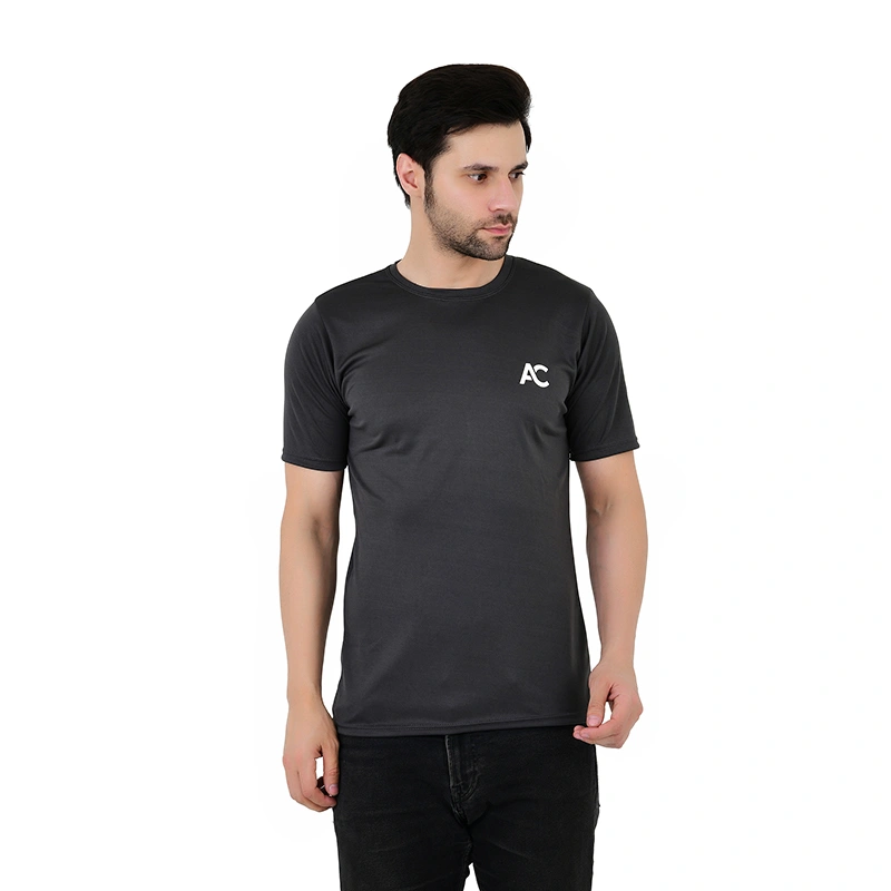 Male model in dark grey sports t-shirt with AC logo print and black jeans - menswear ecommerce photography by Lohar Studio Delhi